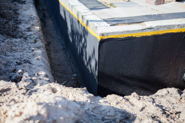 Professional Waterproofing technician working in Woodbury, MN